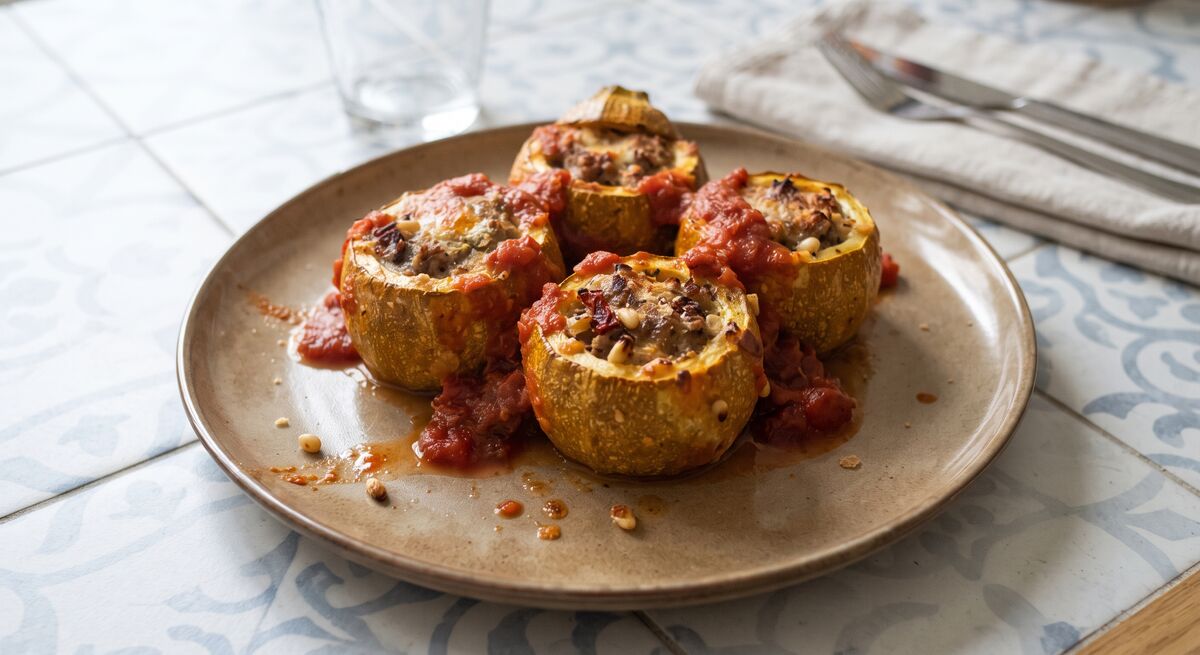 Stuffed round zucchini with meat and tomato sauce